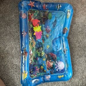 Baby water play mat. Fill with water and baby pushes on it during tummy time.